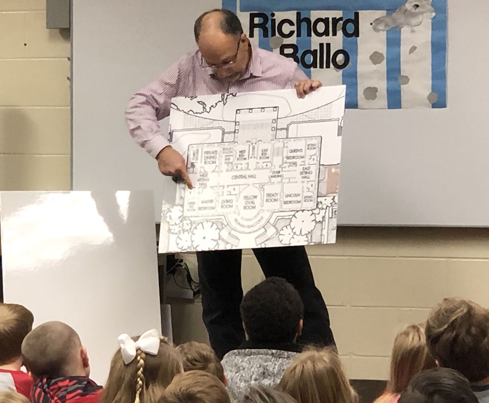 Richard Ballo reads Martin the Mouse in the White House to elementary students during the Amelia Island Book Festival's Authors in Schools event